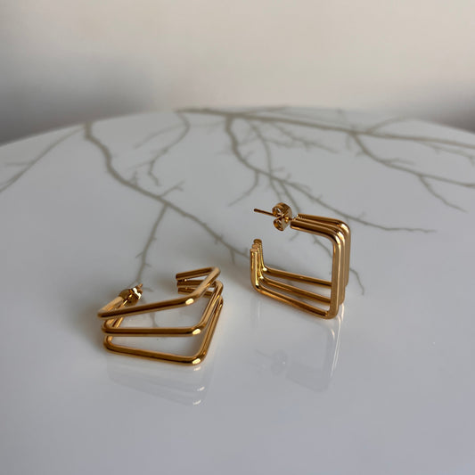 Pendientes triple cuadrado